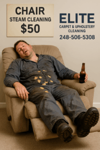 A tired mechanic sleeping in a dirty recliner with chips and a beer beside a $50 chair steam cleaning sign for Elite Carpet & Upholstery Cleaning, 248-506-5308.